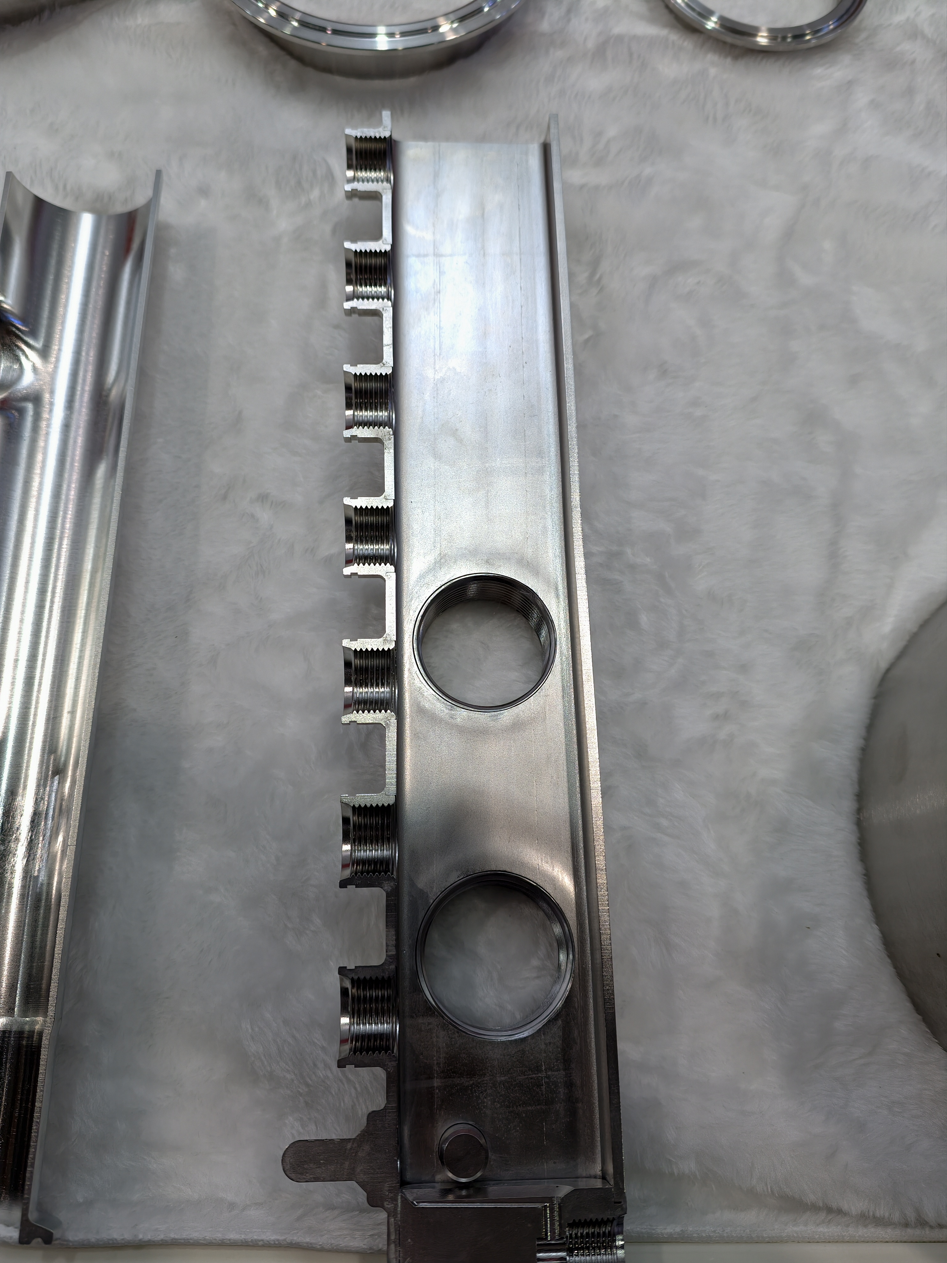 Construction of a stainless manifold with multiple threaded ports.