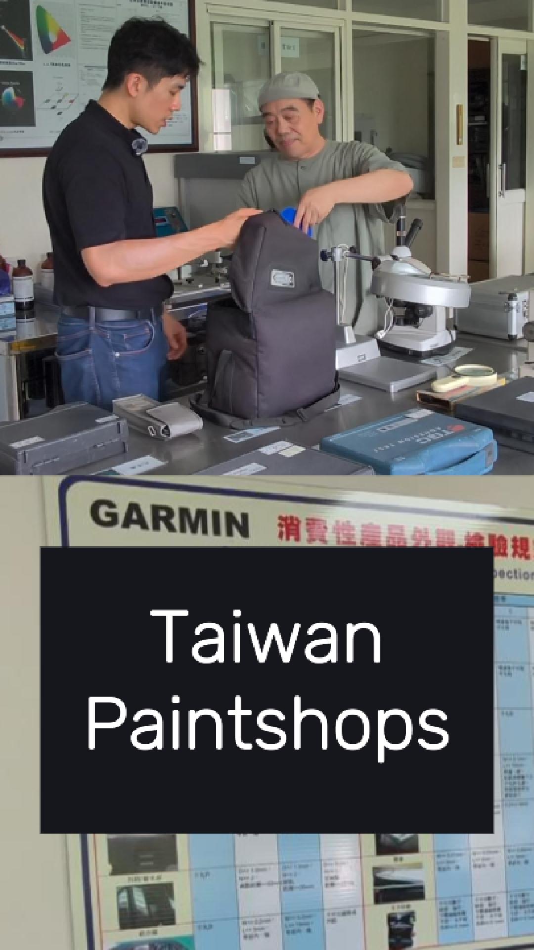 Bert and a coating specialist at an inspection bench in a Taiwan paintshop, with a Garmin inspection chart behind them.